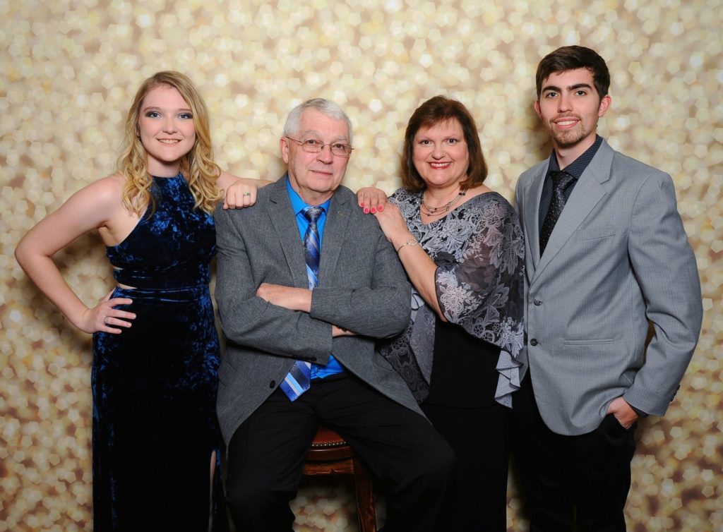 Family picture on cruise.  Lifelong learner and content creator, Robin Smith with her husband, son, and his girlfriend.